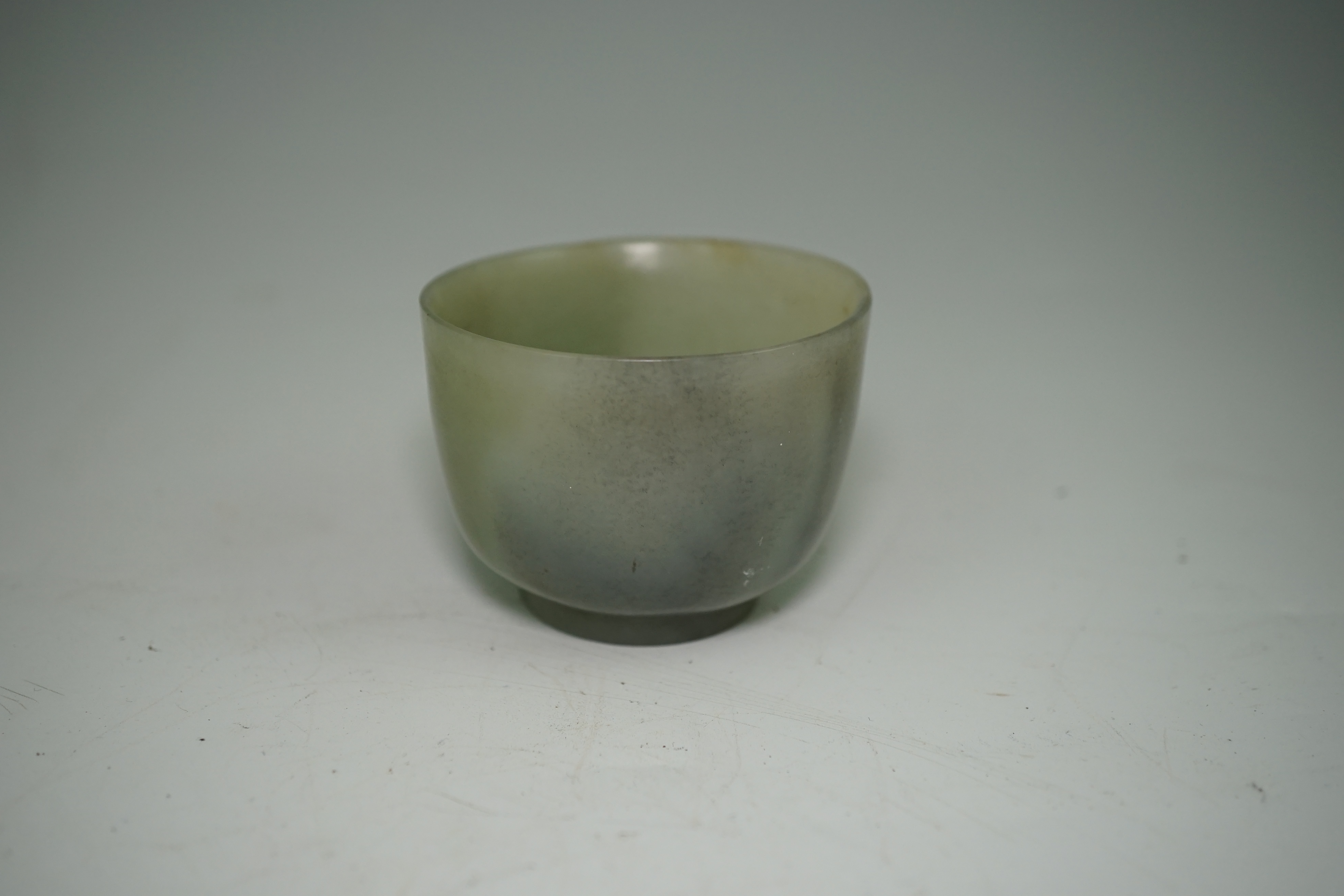 A Chinese pale celadon jade cup, 18th / 19th century